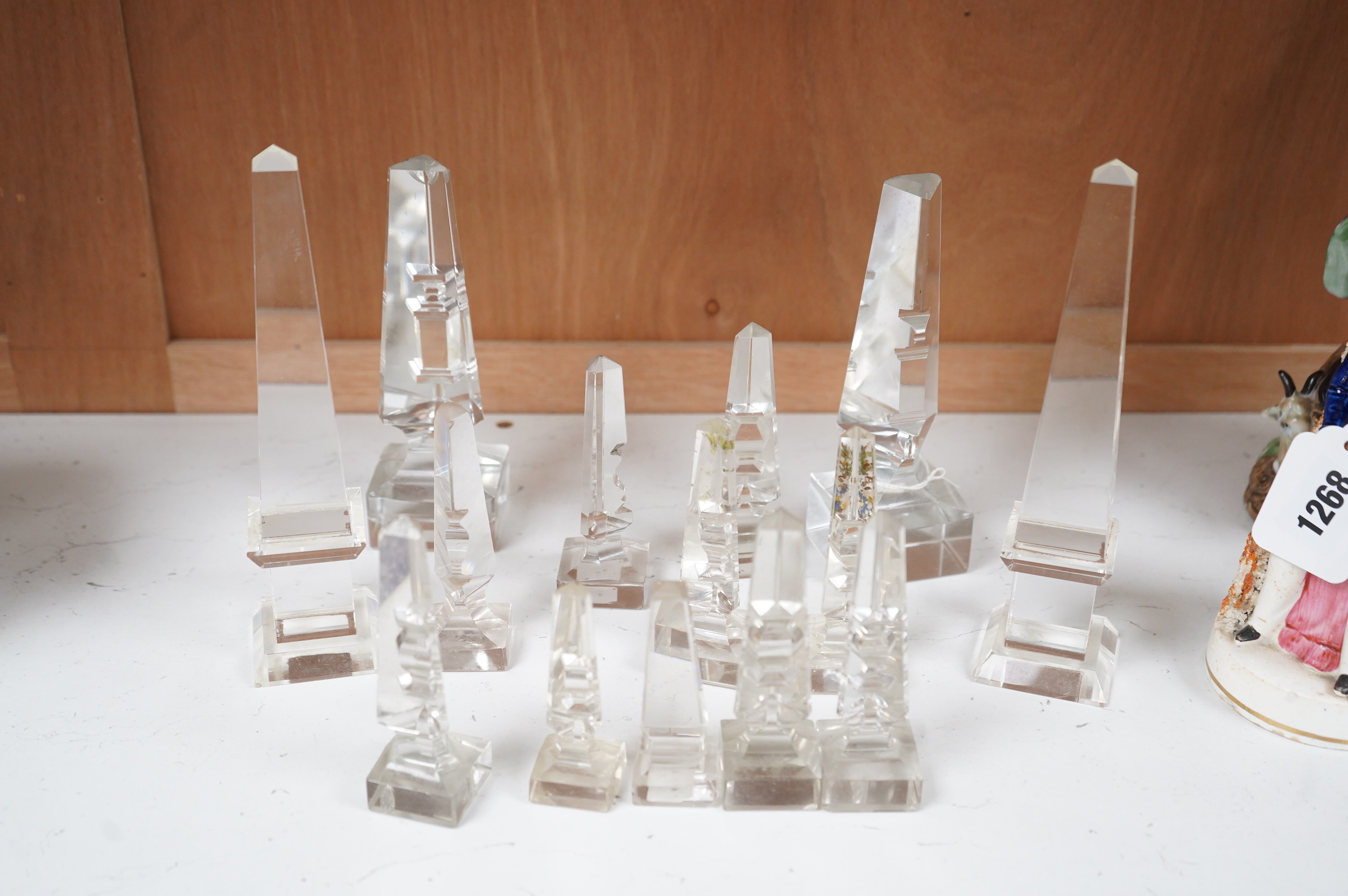 Twelve Victorian glass deceptive obelisks, and two later glass obelisk ornaments, largest pair 21cm high